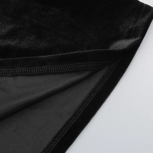 Detail of premium black velvet fabric showing fine stitching and soft texture