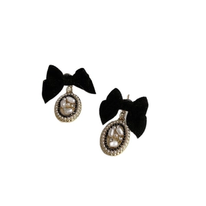 Elegant black velvet bow earrings with gold-rimmed pearl oval drops for women