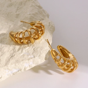 Detailed view of 18k gold stainless steel C-shape hollow textured hoop earrings