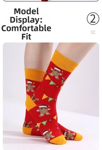 Detail shot of red Christmas socks featuring gingerbread man and reindeer patterns