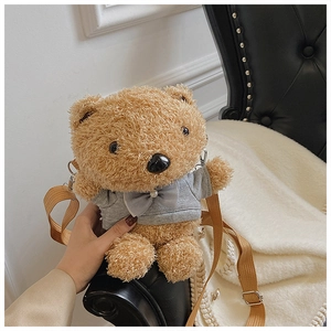 Detail of cute brown plush bear crossbody bag with grey bow hoodie and adjustable strap
