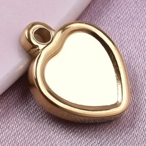 Macro view of a polished gold heart pendant made of high-quality 304 stainless steel