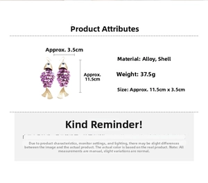 Detail view of large fish-shaped drop earring with purple shell scales and gold alloy