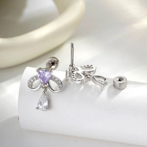 Boucles d'oreilles nœud en argent avec cœur violet et pendentif goutte en cristal