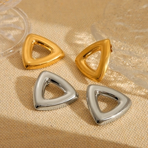 Minimalist hollow triangle stud earrings in gold and silver finish on beige fabric