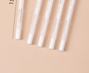 Detail showing white translucent QJ-719 pens with 15cm measurement scale and caps