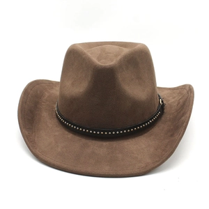 Macro shot of dark brown suede cowboy hat featuring a black leather band with gold rivets