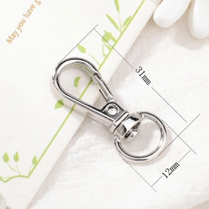 Detailed view of silver metal lobster clasp with rotating ring, size 31mm by 12mm