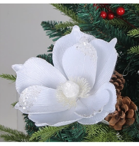 Macro detail of white glitter artificial Christmas flower with silver sequins and berries