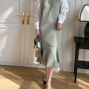 Light green knitted sleeveless mermaid dress styled with a white long sleeve blouse