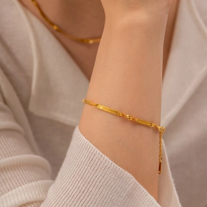 18K gold plated stainless steel snake chain bracelet with elegant twist texture detail