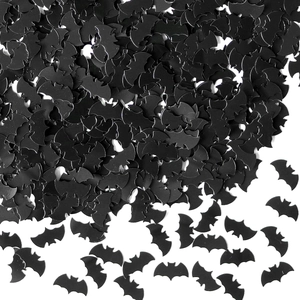 Macro shot of bulk black bat-shaped sequins for Halloween party decoration on white background