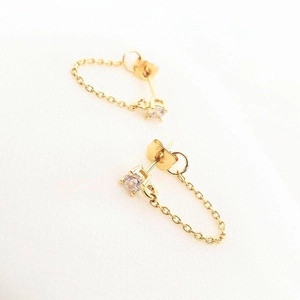 Detailed view of S925 silver needle gold chain earrings with clear zircon stones