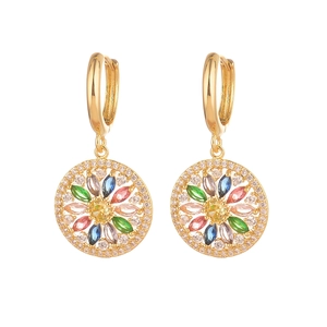 Golden Christmas earrings with colorful zircons and hollow star design on white background