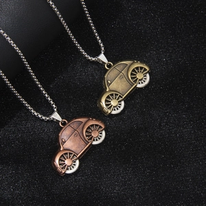 Vintage beetle car pendant necklaces in bronze and antique brass metal finishes