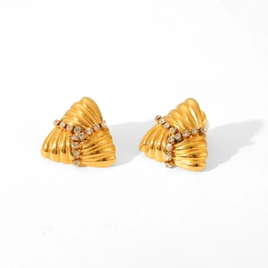 Detailed view of golden fan-shaped earrings with sparkling white rhinestone inlay pattern