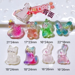 Flat lay of colorful glitter resin animal charms showing front and flat back details