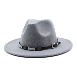 Detail of wool fedora hat with brown leather band and vintage star-shaped metal studs