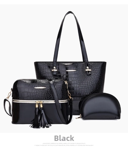 Three-piece black crocodile embossed tote bag set with matching crossbody and clutch bags