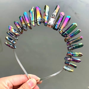 Close-up of rainbow crystal crown headband with silver skull detail and wire wrapping