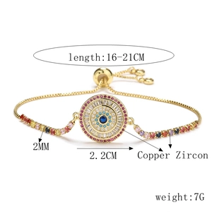 Detail of adjustable evil eye bracelet with colorful cubic zirconia and gold plating