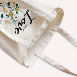 Cream canvas tote bag with daisy floral prints and I want to Love artistic lettering