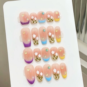 Handmade press-on nails set with macaron french tips and hand-painted tulip floral design