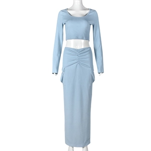 Detail of light blue ribbed knit crop top and drawstring ruched maxi skirt on mannequin