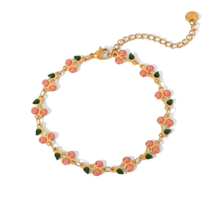 Detailed view of 18K gold plated stainless steel cherry bracelet with lobster clasp