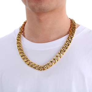 Close-up of 15mm gold Cuban link chain necklace in titanium steel on a male model