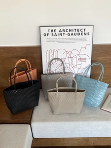 Handmade woven straw tote bags in multiple colors for summer beach vacation style