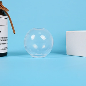 Macro detail of a spherical crystal clear resin mold with flat base for DIY crafts