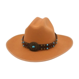 Close-up of a camel wool fedora with a leather band, brass studs, and turquoise accents