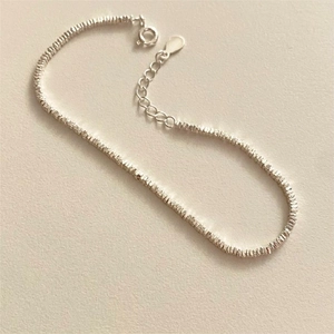 Detailed macro of S925 sterling silver beaded bracelet with adjustable spring clasp