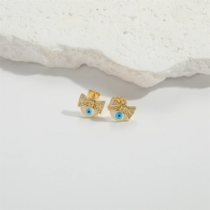 Golden bow evil eye stud earrings with blue enamel and sparkling crystal accents