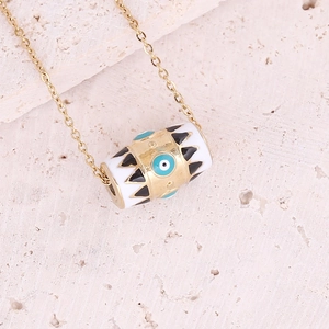 Gold evil eye cylinder pendant necklace with blue zircon and enamel on stone base