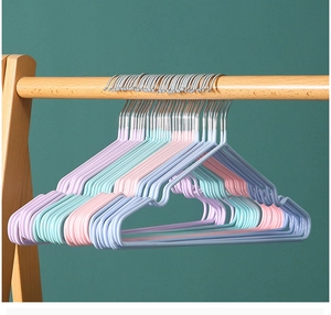 Detail of colorful non-slip coated metal clothes hangers with shoulder notches for dorm use