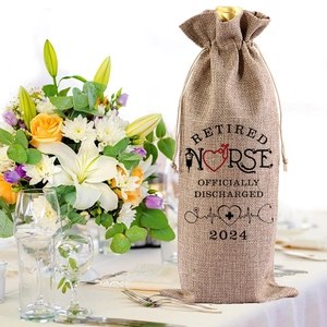 Linen wine gift bag for retired nurse with drawstring closure in elegant table setting