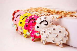Sparkly rhinestone sheep keychains in multiple colors with gold plating for women's bags
