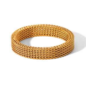 Detailed macro view of the gold mesh woven texture on the stainless steel ring