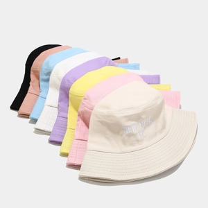 Collection of colorful cotton bucket hats with New York embroidery in various pastel shades