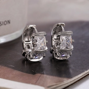 Silver hoop earrings featuring square micro-set zircons and polished pavé details