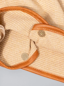 Detailed interior of woven tote bag with magnetic snap closure and leather piping