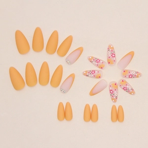 Matte apricot almond press-on nails set with vintage floral prints and tiny rhinestones