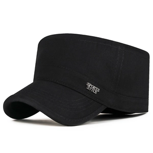 Classic black military flat top hat with metal sports style badge on white background