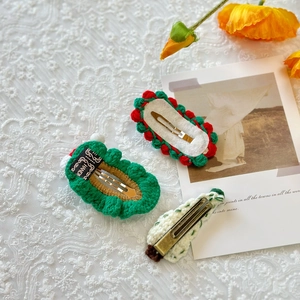 Handmade crochet Christmas tree hair clips set on lace fabric with festive style