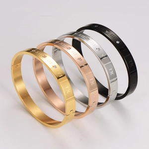 Brazaletes de acero con números romanos y diamante en oro, plata y negro mate