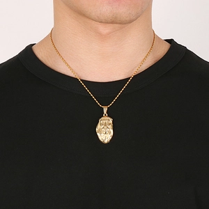 Detailed view of an 18K gold-plated stainless steel Jesus pendant on a rope chain
