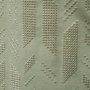 Green slim-fit men's T-shirt with premium geometric embroidery and fine fabric texture