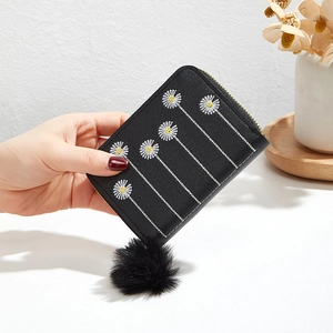 Mini black PU leather wallet with flower embroidery and a black plush pom pom charm